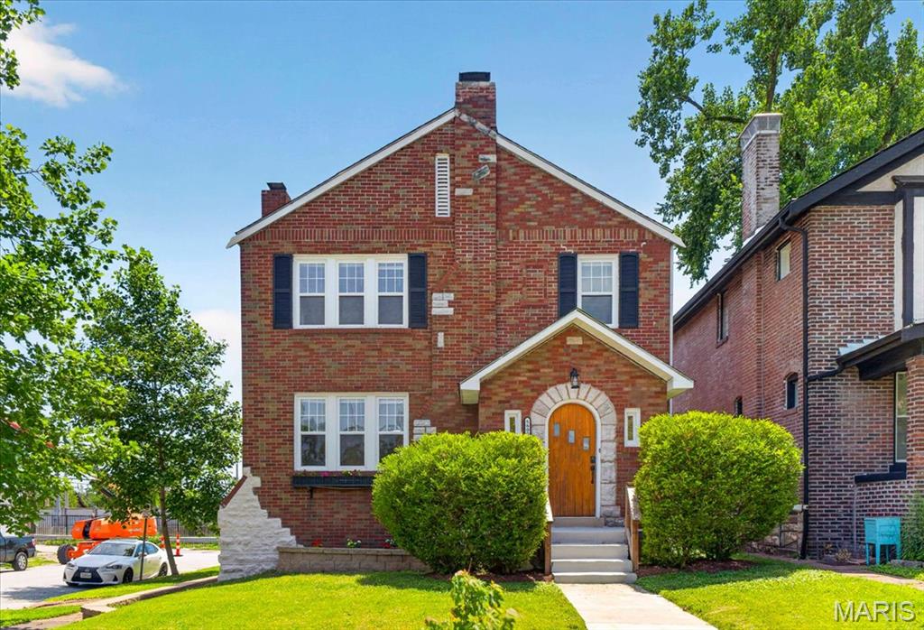 Welcome to this stunning all-brick home that perfectly blends timeless architectural character with contemporary updates. Passing through the charming, custom rounded front door you are greeted by gleaming hardwood floors and an abundance of natural light. The centerpiece of the spacious living room is a beautifully crafted fireplace mantle made of live-edge Ozark cedar. The main level flows into an open-concept kitchen equipped with custom cabinetry and premium granite countertops, right next to a versatile sunroom extending from the dining area —ideal for an office or playroom. Upstairs, the home features four bedrooms and a beautifully finished shared hall bathroom. The basement offers durable epoxy floors, a dedicated laundry space, and plenty of extra storage. Outside, enjoy a private backyard oasis with a premium composite deck, a fully fenced level lot, a rare 2-car garage and a new roof! Perfectly situated in an unbeatable location, you are surrounded by Forest Park, Washington University, the Delmar Loop, and Central West End. This St. Louis gem is truly a must-see!