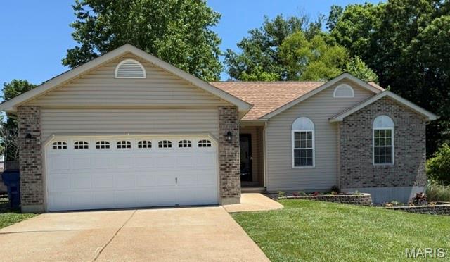Welcome home to this beautifully maintained 3 bedroom 2.5 bath home tucked away on a cul-de-cac.  Featuring vaulted ceilings, spacious living areas, and a functional layout, this home offers comfort and convenience throughout.  The finished walkout lower level includes a large recreation/family room, additional sleeping area, and a half bath - perfect for entertaining, guests, or extra living space.  Step outside to enjoy the fenced backyard with room to relax, play, or entertain.  Major updates provide peace of mind, including heating and cooling October 2024, roof to be replaced prior to closing, and a new hot water heater installed September 2025.  The newer stackable washer/dryer, stove, and refrigerator (October 2025) all stay with the home! Don't miss your chance to own this move-in ready home with a walkout basement in a great location!