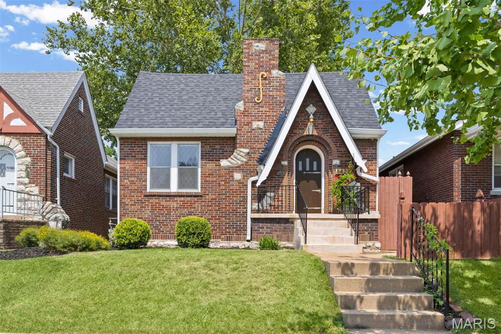 Open House this Sunday the 16th from 1-3pm! Check out this Stunningly charming, Totally Move-In Ready, 1931 gingerbread house with a oversized 2-car garage located in the walkable Lindenwood Park neighborhood of St. Louis!! Beautiful curb appeal with fresh landscaping situates the house on Pernod Avenue just 10 houses down the street from the highly rated Italian restaurant, Trattoria Marcella, and many other restaurants. New roof, gutters, and flashing (June 2026) on the house & garage. Inside the front door you feel like you are in the old world with a breathtaking coffered/beamed/vaulted ceiling living room with millwork, leaded-glass windows, hardwood floors throughout the home. Beautiful lighting through the dining room leads to your fresh kitchen with stainless steel appliances, butcher-block counters, a gas range & white subway backsplash. Two bedrooms & a full bath complete the main level. The master bedroom has more stunning leaded-glass windows & two closets. The other bedroom has updated lights & green wainscoting. The bathroom is beautifully tiled with a shower/tub combo. Downstairs in the lower level there is a finished living space with fresh carpet, shelving & bar area (beverage refrigerator stays) perfect for entertaining! There is also a full bathroom with an oversized tiled shower & a finished sleeping area (3rd bedroom/office/bonus room). Unfinished laundry area, plenty of storage space, workshop area & a cellar complete the basement which walk-outs to the backyard. The backyard is surrounded by an 8+ foot tall privacy fence, has a brand-new covered deck (July 2026) outside the back door & the massive 2 car-garage has two-sided garage doors making it extremely functional for cars, tools, toys & gatherings!! The sewer lateral line was fully repaired & lined by Hoffman Bros (August 2024). The plumbing stack & electric panel are also just a few years old as well making this hidden gem & oasis ready for the next owner!