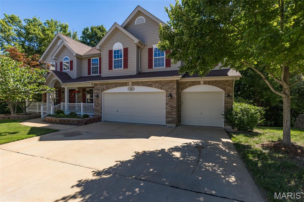 Welcome home to this impressive 4-bedroom, 4.5-bath two-story offering over 4,800 square feet of total living space and nestled on a quiet cul-de-sac in one of the area’s most desirable family-friendly communities. Residents enjoy access to the subdivision pool, private lake, clubhouse, and a neighborhood atmosphere that is second to none. From the moment you step inside, you’ll be greeted by a bright, open foyer with soaring ceilings overlooking the second floor. This spacious floor plan is designed for both everyday living and entertaining, featuring a large kitchen with center island, built in stainless appliances including refrigerator and microwave, abundant cabinetry, and a walkout leading to a large deck overlooking the private, wooded backyard—perfect for outdoor dining, entertaining, or simply enjoying the peaceful setting. Family room is warm and inviting, with a wood-burning fireplace and wall of windows. The main floor also offers a formal dining room with wainscoting, a separate living room or office, and an oversized laundry room complete with utility sink. Upstairs, you’ll find a spectacular loft area perfect for a second family room, game room, or kids’ retreat. The expansive primary suite features a luxury bath and oversized walk-in closet, while the additional three bedrooms offer walk-in closets and private bath access. The finished lower level provides even more living space with a massive recreation/family room, second fireplace, full bath, and bonus room ideal for a home office, gym, or hobby space. Additional highlights include an oversized 3-car garage, dual HVAC systems replaced approximately two years ago, new carpet on the main and upper levels, fresh paint throughout, and exceptional pride of ownership. Offering the perfect blend of space, comfort, and community amenities, this exceptional home is sure to please!