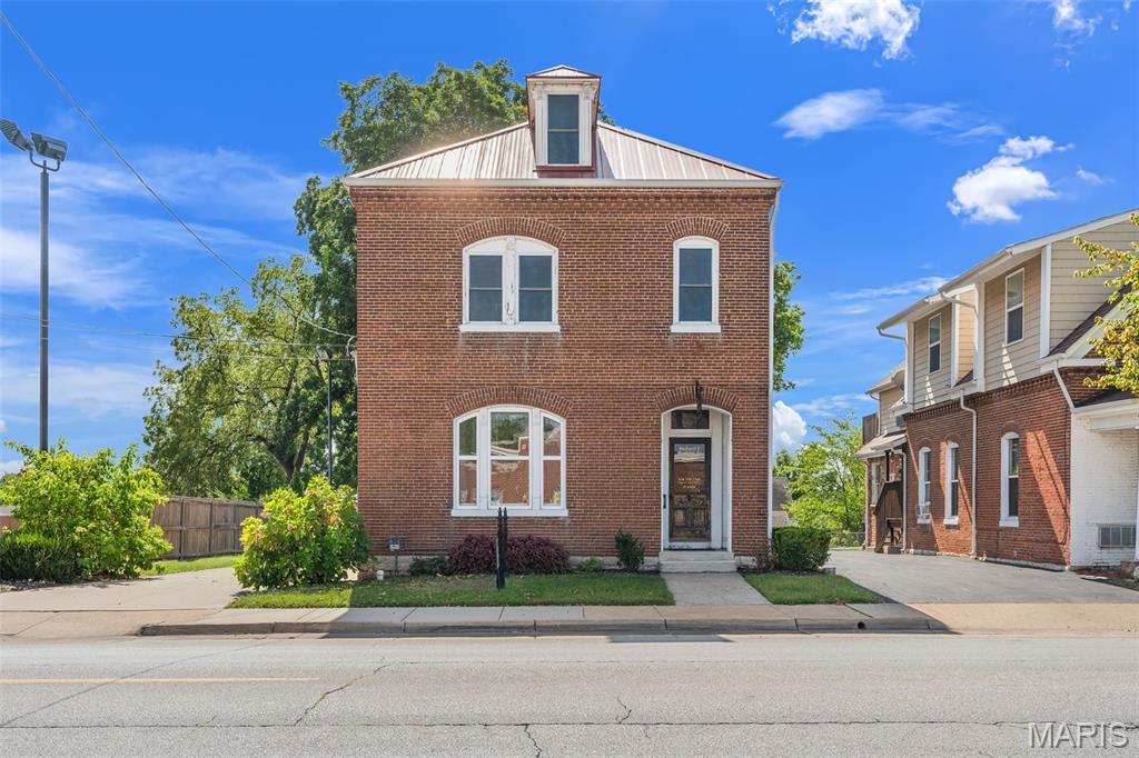 High Traffic location & excellent visibility, This charming updated 3-story commercial building is ideal for owner-occupant or investor. Zoned C-2 Overlay for flexible commercial potential (buyer to verify specific uses). This building is approx. 2100 sq ft+/-, built in 1890 and lovely maintained, it has a blend of historic character with functional commercial space. The main floor offers an attractive entry with a beautiful original staircase leading to the upstairs. Large front room office space with decorative (non-functional) fireplace, some original windows, shutters, hardwood floors, three additional rooms and half bath. The upper level will find you multiple office spaces (two currently leased), a kitchenette, and half bath. The third level is great for an additional office space or bonus room. Nice covered back porch with composite floor. Asphalt parking lot in the rear for 5 cars. (Upper two offices currently rent for $700 month-to-month). Make your appointment to see this charming Commercial Building! Listing agent has to accompany. Property is being Sold in Current Condition "Sold As Is" Seller will do no repairs.