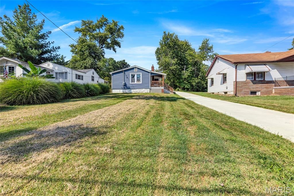 Welcome to this charming 3 bedroom, 1 bathroom home perfectly situated in Maryland Heights, MO! With its comfortable and functional layout, wonderful outdoor spaces, and great location, this comprehensively updated property offers a fantastic opportunity for a variety of buyers.

This home has been thoughtfully and extensively updated from top to bottom by the current owner, including a new driveway and sidewalk, all new plumbing, updated electrical, new flooring, and a fully updated kitchen and bathroom. All work was completed with city-approved plans and inspections, and all receipts are available, giving you exceptional peace of mind and confidence in your investment from day one!

Step inside and discover a warm and inviting family room that's the perfect space for relaxing and gathering with friends and loved ones. The well appointed kitchen features a convenient breakfast bar and a charming look through to the family room, creating an open and connected feel that is perfect for everyday living and casual entertaining. Three comfortable bedrooms and a full bathroom round out the interior, providing a cozy and practical layout that works beautifully for a variety of lifestyles.

Step outside and enjoy the spacious yard that's a wonderful outdoor retreat with plenty of room for gardening, entertaining, play, or simply soaking up the outdoors. A covered porch provides the perfect spot for morning coffee and relaxing evenings, while the detached garage adds everyday convenience and valuable additional storage space.

With its comprehensive updates, comfortable layout, great outdoor spaces, and fantastic Maryland Heights location convenient to shopping, dining, and major roadways, this home is a wonderful opportunity you won't want to miss. Schedule your private showing today!