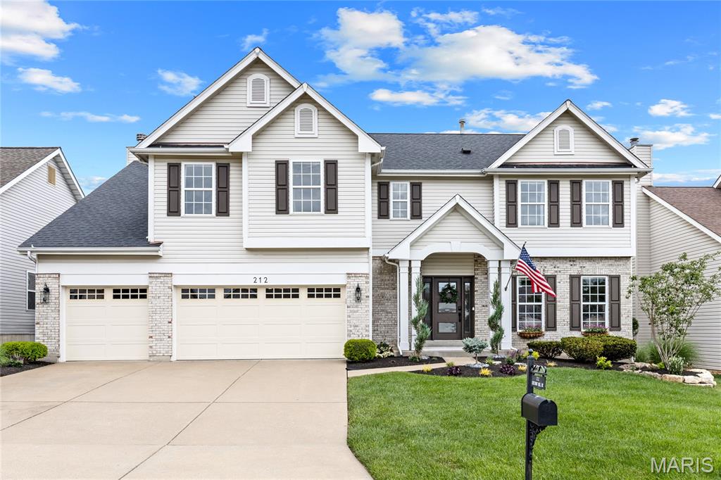 Spectacular 2-Story Brick Home in Prestigious WingHaven This exceptional Mayer-built home showcases well-proportioned rooms, soaring ceilings, wide-plank hardwood floors, and exquisite custom trim work throughout. The impressive foyer, highlighted by a custom frosted-glass entry door, opens to a formal dining room, private study, and a stunning family room featuring a slate fireplace and dramatic bay window. The spectacular kitchen offers 42-inch white and walnut custom cabinetry, granite countertops, Café appliances, and a large center island. The adjoining breakfast room is enhanced by designer lighting, creating an ideal space for everyday living and entertaining. A convenient back staircase leads to a spacious bonus room with a cathedral ceiling, as well as the luxurious primary suite featuring a spa-inspired bath with a freestanding soaking tub. Three additional bedrooms, a full hall bath, and a convenient second-floor laundry room complete the upper level. The finished lower level provides exceptional entertainment space, including a recreation room and game room. Outdoor amenities include a private patio, fresh professional landscaping, and an oversized three-car garage. Located within the award-winning Wentzville School District, this home is just a short walk or golf cart ride from WingHaven Country Club, offering premier golf, dining, and community amenities. A rare opportunity to own a distinguished home in one of WingHaven's most sought-after neighborhoods.