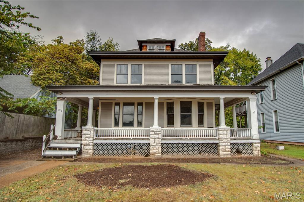 This Alton gem has the stunning woodwork and architectural bones longing to be restored to its prominence in this historic district. Full of character, featuring original wood floors, custom built-ins, and inviting living spaces. Endless possibilities await to revive a cozy living room with a fireplace, an elegant dining area, and a kitchen with a walk-in pantry and access to a covered back porch. Relax or entertain on the wraparound porch, or retreat to one of five upstairs bedrooms, including a private balcony. Additional attic space offers plenty of storage. Just steps away from Dukes Bakery and moments away from the quaint restaurants, shops and riverfront that make Alton home. The roof, soffit and fascia are new as of 2022.  Schedule your appointment to take in all this home has to offer. Sold AS-IS. Seller will do no repairs. Seller will not provide occupancy permit.