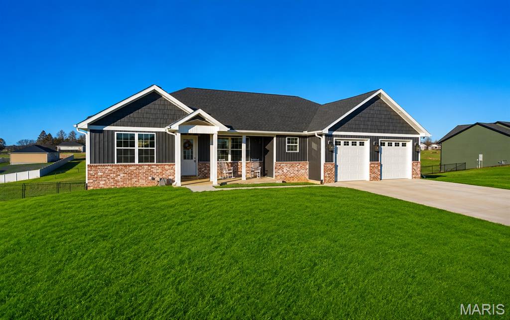 Breathtaking 5 bedroom, 3 full bathroom home on a sprawling 1 acre lot located in Jackson! This stunning one year old home offers the perfect blend of style, space, and comfort with an attractive brand new fence! Step inside to an open concept layout filled with natural light, hardwood floors, a gorgeous kitchen with a large center island, a spacious walk-in pantry, perfect for all of your storage needs, and an oversized laundry room. The beautiful master suite is a true retreat, featuring lots of space and a luxurious walk-in closet.
Head to the lower level and you will find a gorgeous finished basement with a family room, a bar area-already plumbed and ready to become a full kitchenette, and two other bedrooms and full bathroom. Whether you're hosting guests or enjoying quiet evenings, the covered deck is an ideal spot to relax. Make an appointment today to tour this exquisite home!