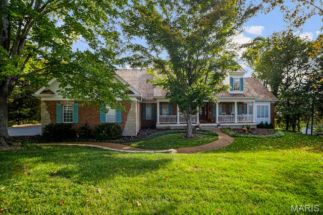 Get Ready for Golfing, Pickleball, Tennis, Swimming--you can have all the summertime fun with this Beautiful Home in Cedars Valley in St. Albans.  Why wait months for new construction when you can move right into this gorgeous brick and stone, custom designed and upgraded, Gruchalla & Cover home.    Compared to the standard builder models to be built in this area, your dollar will certainly go further here in this large home with 4216 sq ft on main and upper floors.   As you turn off the main road onto a secluded drive with private entrance, you will see your new home nestled on an expansive hilltop 1.26 acre lot with plenty of mature trees providing further privacy.   Enjoy the view of your  lot from your 2 story great room with a wall of windows.  Whip up culinary creations in the kitchen with newer appliances 2024, Corian countertops, 42" solid Cherry cabinets, and custom tile flooring for easy maintenance.   The primary suite with bay window is your respite from a busy world with the adjoining luxury bath with large soaking tub for relaxation, marble shower, and his & hers walk-in closets!   Work from home or entertain important clients in your spacious main floor office with a full wall of floor to ceiling built-in bookcases.    Lovely formal dining room with gorgeous moldings and hardwood flooring for those family gatherings, and cozy up next to the fireplace in the breakfast room while you watch the chef of the home prepare those gourmet meals!    
In addition to 3 spacious upper level bedrooms(and two full baths), there is an additional full suite on the main floor.   This is a unique feature perfect for extra guests or family members that need one floor living.  Dreaming of a Wine Cellar, entertainment area, or another space to get away to? The 3000 sq ft walk-out basement with 10' pour, floor to ceiling windows for exceptional natural lighting, and a full rough-in is waiting for your personal finish!    Lovingly maintained by the original owners, it has many updates/upgrades for a worry-free exterior; newly stained and sealed cedar shake roof, new gutter guards, new exterior paint, inground sprinkler, Pella windows throughout, some newer carpeting hallway and stairs upper floor 2026;  see the additional features attachment...the list goes on!