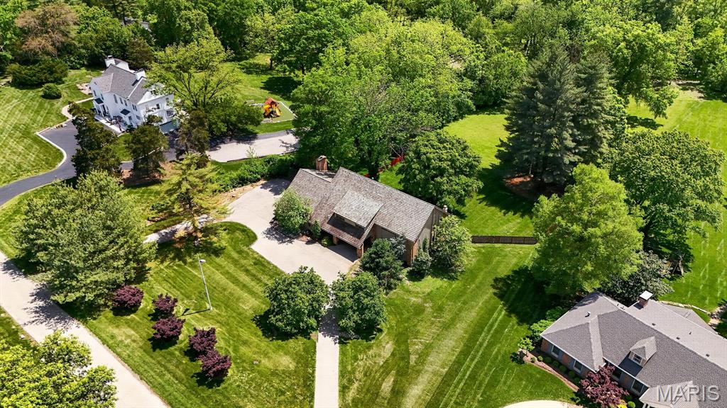 New Price! Stunning 3-acre property in the highly sought-after Kirkwood School District—offering an exceptional opportunity to create your dream home in a premier setting. With 3-acre minimum zoning and surrounded by over 50 acres of neighboring estate-sized properties, this is a rare chance to secure a private, picturesque homesite with direct access to Bridle Trails. The gently rolling land, mature trees, and expansive footprint provide the ideal canvas for new construction—whether envisioning a modern estate, timeless traditional, or luxury retreat tailored to your lifestyle. The setting offers both privacy and connectivity in the heart of Huntleigh. A Colorado contemporary home, designed by Ted Christner, currently sits on the property and offers over 5,500 square feet of living space. With soaring vaulted ceilings, sun-filled interiors, and multiple indoor-outdoor living areas, the home is perfectly livable as-is or could serve as a comfortable residence while planning your future build. Properties with this combination of acreage, location, and building potential are rarely available—an extraordinary opportunity to create something truly special. Hurry, before it's too late!