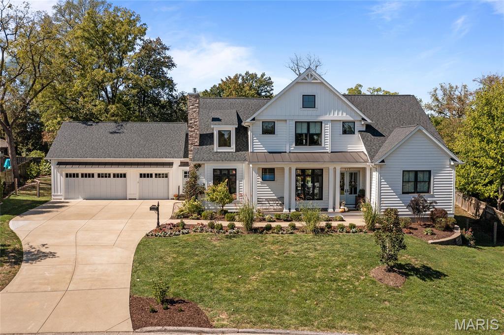 Welcome to this custom-built modern cottage, perfectly set on over half an acre along a charming street in Kirkwood. Blending timeless design with modern amenities, this home offers multiple entertaining areas including  two covered porches, multiple patios, firepit area, enclosed backyard garden. Interior has open family room, hearth room and flexible dining space that can easily serve as a home office or den.

The chef’s kitchen is a centerpiece, highlighted by a 48" dual-oven Wolf range, Sub-Zero refrigerator, and generous layout designed for a second island or reimagined dining area. Architectural details shine throughout, from soaring 10-foot main floor ceilings to cathedral accents and custom wall treatments. Each bedroom is a private en-suite, while the story-and-a-half floor plan provides opportunity for expansion into the spacious attic.

Practical features abound with an oversized three-car garage, 5" insulated vinyl siding, two hot water heaters, and dual 4-zone HVAC systems. The full basement, with 9-foot pour, finished bath, safe room with steel door, and private entrance, offers endless potential to finish—whether for recreation, a mother-in-law suite, or separate apartment. With a large lot suitable for a pool or even a pickleball court, this home truly combines comfort, flexibility, and lifestyle. Where architectural detail and lifestyle convenience come together, this is the one to see!