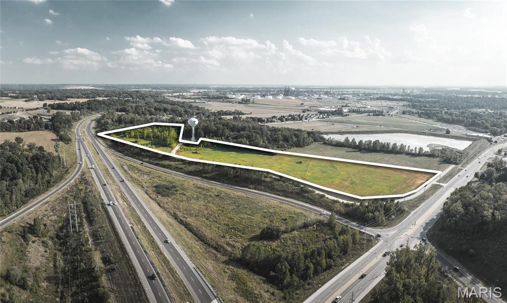 PRIME LOCATION!! Can be divided as low as one acre. Concrete frontage road, curb and gutter already in place. Just off IL 255 and RT. 111 Near Walmart, Aldi, Applebee's and many other businesses. Location: City, High Traffic, Hwy/Interstate Frntg