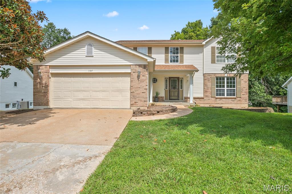 1107 Winter Park is a spacious 5-bedroom, 3.5-bath home with abundant storage, flexible living space, and plenty of opportunity to make it your own.

Conveniently located near major highways and less than five minutes from Gravois Bluffs, the home puts shopping, dining, entertainment, and everyday necessities within easy reach.

Outside, the huge, level backyard is fully enclosed by 6-foot vinyl privacy fencing and backs to wooded common ground. Enjoy the view from the large deck off the kitchen, relax on the patio, or transform the extended paver area into a fire-pit retreat, play space, or outdoor entertaining area. A generously sized shed/workshop provides additional room for storage, hobbies, and projects.

Inside, storage is equally impressive. The oversized two-car garage features built-in shelving, while the fully finished basement includes two additional storage rooms.

Four bedrooms are located upstairs, and the finished lower level adds even more versatility. A private fifth-bedroom suite—with its own walkout entrance and bonus living area—offers an ideal setup for guests, extended family, or anyone seeking a separate space of their own.

Several major updates have already been completed: the roof, HVAC system, and tankless water heater are all less than five years old, and the flooring is covered by a transferable warranty.

Move-in ready today with plenty of opportunity to make it your own, 1107 Winter Park offers the space, storage, outdoor living, convenient location, and valuable updates buyers have been looking for—all at a newly improved price.