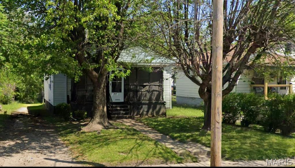 Solid 2-bedroom, 2-bath ranch home featuring a full basement, durable vinyl siding, and an enclosed porch for additional living or flex space. Situated on a main road for convenient access, the property is nicely shaded by mature trees, providing added privacy and a pleasant setting. This property is being offered as a cash sale only, with no contingencies accepted, and is sold strictly as-is, where-is. No interior showings will be permitted, no additional interior photos are available, and interior access for inspections will not be granted. No survey or keys will be provided. All listing information is deemed reliable but not guaranteed, and buyers are responsible for completing their own due diligence prior to submitting an offer. Buyers must independently verify all property details, including but not limited to the number of bedrooms and bathrooms, square footage, room sizes, lot dimensions, and any other relevant information. Photos and marketing remarks are provided for reference purposes only. By submitting an offer, the buyer acknowledges they have independently investigated the property and are making their purchase decision based solely on their own findings. Buyer or buyer's agent to verify MLS info