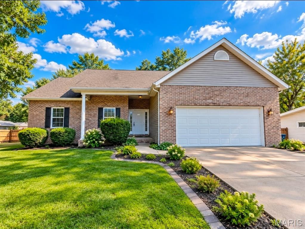 Imagine spending your summers in Holiday Shores, lake days, neighborhood fun, the 4th of July festival, and fireworks lighting up the sky! This spacious 4-bedroom, 3 bath ranch offers over 3000 sq. ft of living space, beautiful lake views and Holiday Shores lake privileges without the lakefront price tag.  The main level features a desirable split-floor plan with a private primary suite and ensuite bath.  All appliances stay!  The finished lower level offers plenty of room to spread out with a family room, rec room, two bonus rooms, and a full bath.  Perfect for guests, hobbies, a  home office or entertaining.  Outside, the covered patio flows directly onto an expansive deck overlooking the fenced backyard, creating a wonderful space for summer BBQ's,  morning coffee and evenings w/friends.  Recent storm activity means the backyard needs some cleanup but the potential is easy to see.  Attached 2 car garage.  Priced with value in mind and ready for its next chapter.  Bring your offer and start enjoying the Holiday Shores lifestyle.