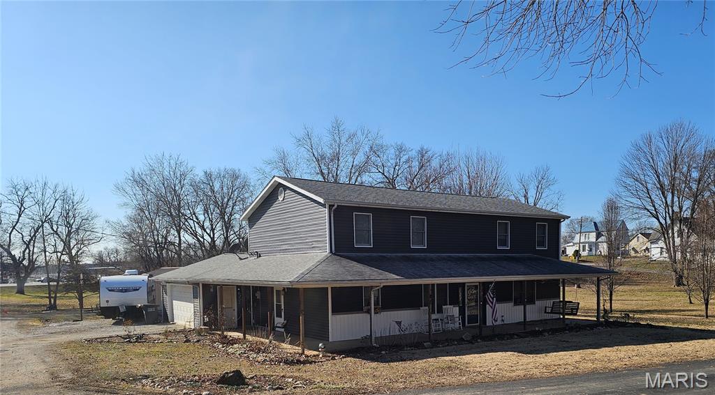 Spacious and move-in-ready home on over half an acre!
Welcome to this beautiful, move-in ready home offering space, comfort, and functionality inside and out.  The large kitchen features abundant cabinetry, a pantry, and plenty of room for cooking and gathering.  A dedicated laundry room adds everyday convenience.  You will enjoy a generous family room that opens directly to the back patio-perfect for entertaining or relaxing.  The home includes three spacious bedrooms and three full bathrooms, with a private master suite featuring a walk-in closet and luxurious soaking tub. Partial, dry basement adds plenty of space for storage and storm protection. Situated on two corner, large lots totaling over half an acre, this property also offers exceptional garage space:  A two car attached and a two car detached garage.  The detached garage offers a walk in freezer - ideal for storage, hobbies or special needs.  Did I mention a wrap-around covered, front porch with a swing?  You will fall in love with everything this home has to offer both inside and out.  Don't miss this opportunity for space to grow and room to enjoy with family and friends!  Updates include, roof, siding, lvlp flooring,  kitchen appliances, counter top and hot water heater.  HVAC installed in 2018.