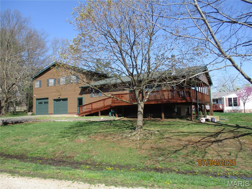 Check out the new asking price a big reduction. Seller's have relocated and are very motivated to sell. If you are looking for a big home to raise your family and entertain this nice home is located at Indian Hills Lake offers 2 lots with a great lake view and close to boat launch. Home has recently added updates including roof, siding, deck, furnace, hot water heater, garage doors, guttering and  exterior doors, septic inspection done and a new survey. Home offers 5 bedrooms, 2 bath 4 bedrooms on upper level and 1 bedroom on main level. Walkout basement has a family room and game room.  2 car attached garage on lower level heated and cooled.  New deck with great view to entertain family and friends.  Enjoy the lake, fishing, boating, beach, tennis courts, pickle ball courts and community center something for everyone.