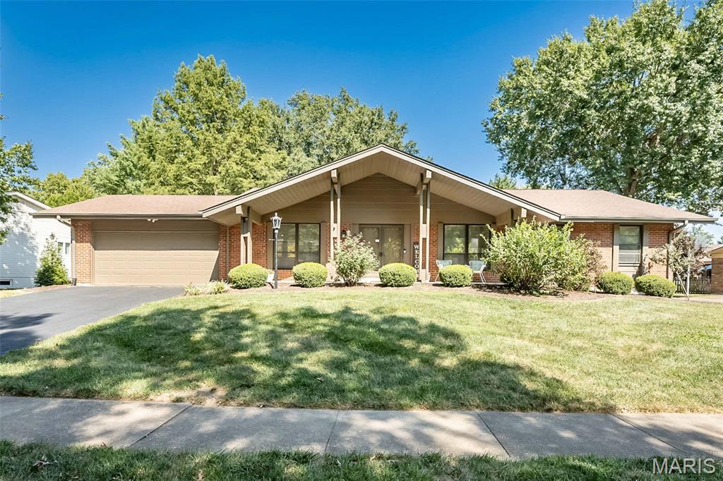 Welcome to 1538 Woodroyal West Drive, where generous living space, classic character, and a fantastic Chesterfield location come together! This 4-bedroom brick home offers approximately 3,900 square feet of finished living space, 2 full and 2 half baths, plus a finished lower level that adds even more room to spread out. Step inside to fresh paint, newer flooring, and multiple spacious living areas, including formal living and dining rooms plus an inviting family room featuring a wood-burning fireplace and an impressive wall of built-in bookcases.

The bright kitchen offers abundant cabinetry, stainless steel appliances, plenty of workspace, a center island, and an adjoining breakfast area. Practicality meets convenience with main-floor laundry and exceptional storage throughout the home, including dedicated coat, linen, and utility closets. The generous primary suite offers plenty of room to unwind with a private bath featuring a soaking tub and separate shower, while three additional bedrooms complete the upper level.

Downstairs, the lower level expands your living space with a spacious finished area featuring multiple recreation spots, a wet bar, and a half bath—ideal for game days, movie nights, or hosting holidays! Beyond the finished area, you’ll find a dedicated unfinished storage room to keep things organized, plus an additional unfinished room that provides outstanding potential for future expansion.

Effortless indoor-outdoor living awaits with access to the backyard from the kitchen, family room, or convenient garage service door. Step outside onto the oversized patio featuring a well-maintained hot tub, all overlooking a level, fully fenced backyard with mature trees and plenty of room to play, garden, or relax. Utility shed with solar lights. Hard wired exterior cameras.

A new furnace was installed in June 2026 and includes an extended warranty! Located in the Parkway School District with convenient access to Chesterfield shopping, dining, and major highways. Four bedrooms, multiple living spaces, hot tub, expansion potential, and a fenced backyard in Chesterfield! There’s a lot to love here, so don’t wait to see this one in person! 
Open Houses Friday, Saturday, and Sunday!