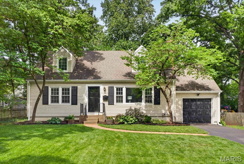 1117 Elm Dr is a beautifully renovated Cape Cod that perfectly blends classic charm with modern convenience in an ideal Webster Groves location. This move-in-ready home features 4 bedrooms, 2 fully renovated baths, a stunning kitchen with granite countertops, custom cabinetry, and quality finishes, plus spacious living areas filled with abundant natural light. The flexible floor plan includes two main-level bedrooms, offering options for a primary suite, guest space, or home office and 2 additional 2nd floor bedrooms with a full hall bath. A private sunroom (not included in the square footage) is accessible from the primary bedroom and opens to the backyard patio, creating the perfect retreat for relaxing or entertaining. The unfinished lower level provides the opportunity for additional living, recreation, or workout space. Tucked away on a quiet, picturesque street in one of Webster Groves' most desirable neighborhoods, you'll enjoy easy access to the rec complex, parks, shopping, dining, and award-winning schools. Simply move in and experience the charm, convenience, and sense of community that make Webster Groves one of the most sought-after areas to call home.