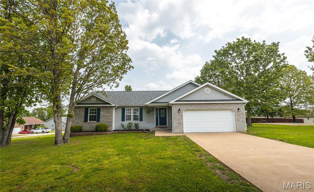 Welcome to this beautifully maintained 3-bedroom, 2-bath home located in the highly desirable Shalom Mountain subdivision—just minutes from Fort Leonard Wood. This move-in ready home offers a perfect blend of comfort and style, featuring a spacious layout with vaulted ceilings that create an open, airy feel. Recent updates include new flooring throughout, adding a fresh, modern touch to the home. The kitchen is equipped with sleek stainless steel appliances, and all appliances are included, making your move even easier. This home also includes a water softener system, adding an extra layer of comfort and efficiency for everyday living. Enjoy outdoor living on the nice deck overlooking well-maintained landscaping, ideal for relaxing or entertaining. The property also includes a 2-car garage with built-in storage, providing plenty of space for organization. Residents of Shalom Mountain benefit from access to a shared pavilion through the HOA—perfect for gatherings and community events. Whether you're looking for a primary residence or a convenient location near base, this home checks all the boxes.