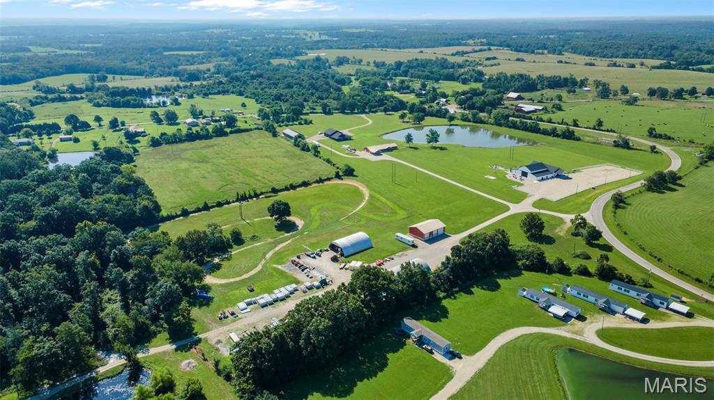 Contact agent for a full list of amenities. Luxe Private Estate + Thriving Event Venue on 14 Acres. An extraordinary opportunity awaits at this versatile 14-acre private estate, combining luxury living with a proven income-generating business. Nestled in a peaceful rural setting, this property features an 8,000 sq ft fully booked wedding and event venue, and a long list of top-tier improvements designed for both lifestyle and functionality.  This is more than a home—it’s a turnkey estate compound built for multi-use living, entertaining, working, and earning.  Home:• 4,600 sq ft under roof• Also constructed with 9 ft walls for maximum energy performance
• Ideal for multi-generational living or rental income.  Turn-key Event Venue
• 8,000 sq ft wedding/event facility with a packed booking calendar
• Engineered with ceiling high ranging from 10 ft to 27 ft. 
• Elegant, climate-controlled space ready to host large weddings and corporate events.  
Price includes 14 acres, primary residence and venue.
Just venue can be sold with 5 acres at  $1,250,000
