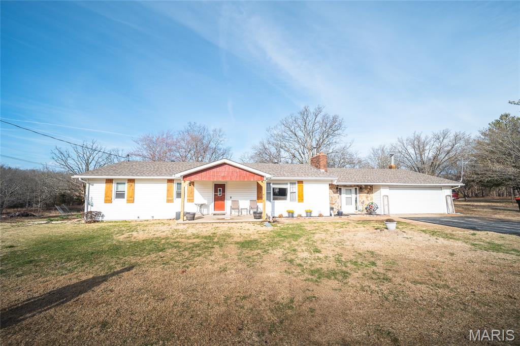 Beautifully remodeled 4-bedroom, 2-bath home on 4+ acres featuring a private pond stocked with 15 species of fish. This property offers peaceful country living with modern updates throughout.
The home has been completely renovated inside and out, showcasing exposed wood beams, custom stonework, and durable vinyl plank flooring. The spacious kitchen provides plenty of room for cooking and entertaining, while the large master suite offers a comfortable private retreat.
Cozy up by the indoor fireplace, or enjoy outdoor living on the screened-in porch overlooking the property. Additional features include an outdoor wood furnace, barn/shop, carport, 2-car garage, paved driveway, and a beautifully maintained zoysia lawn.
Major updates include a new roof and well installed in 2025.
This property combines space, privacy, and modern comfort with plenty of room for hobbies, recreation, or simply enjoying nature.