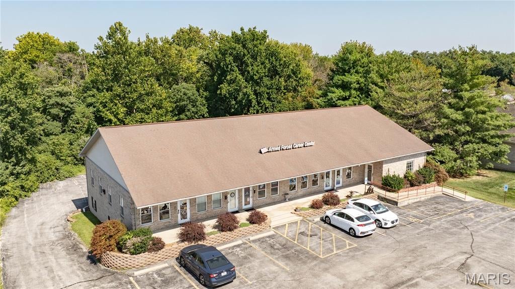 Great location for a professional office! This commercial building sits along a well-traveled road with good visibility and easy access. The property would be a great fit for an attorney, insurance agency, accounting firm, medical or professional office, or a variety of other businesses.

If you're looking for a location that's easy for clients to find and convenient for employees, this property is worth taking a look at. There's plenty of potential here to make the spaces work for your business.