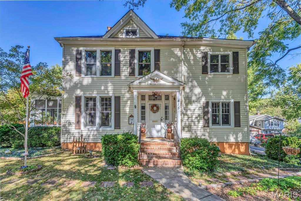 This Certified Ferguson Century Home, built in 1892 by Dr. Case for his beloved daughter, Sallie George Case, has history oozing out of every nook and built-in.  When you walk in the door, you can feel the love that was put into every restoration and improvement. No woodwork has been harmed in this gleaming home. A gas log fireplace warms the cozy living room. Spring weather on the screened-in sun porches brings a true feel of luxury to your days. The enormous dining room can host your significant events with ease. Featuring a large walk-in pantry, ample cabinets, the kitchen also provides a center island. Don't miss the main floor half bath and the breakfast room.  An office is tucked discreetly by the spiraling staircase to the upper floors. Each of the three large bedrooms has an attached sitting room, which could be used as an additional bedroom, resulting in a total of five bedrooms.  The primary bedroom features an en suite bathroom, a luxurious walk-in closet, and a private balcony, unheard of in this age of home.  An additional full bath is easily accessible to all the ancillary bedrooms.  The attic, though unfinished, features a large closet and extensive space for storage.  Don't overlook the lower-level family room, which features a bar built from some of the home's old doors and windows during upgrades.  Off the laundry room, you will find access to a work area, additional storage, and a tuck-under garage. There is ample parking in the enormous driveway and in the enclosed, detached, two-car covered carport.  Walk in the footsteps of Ulysses S Grant, who, as a young man, was tasked with harvesting wood from the property for visitors and residents of Ferguson.  Experience the beauty and community that Ferguson has to offer. Many restaurants are within walking distance. The farmers' market will begin soon, where you can support local urban farms and beekeepers. Concerts and celebrations are commonplace in this close-knit community. You won't regret it!