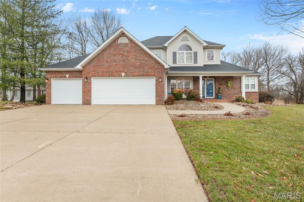 WOW! This beautiful 1.5 story home located on large beautiful yard tree lined with plenty of space to relax.  Interior features large foyer and dining room w/hardwood flooring. Family room with vaulted ceiling and gas fireplace, flanked w/floor to ceiling side windows. Large kitchen w/breakfast room, along with oversized kitchen, island with pullout shelving, desk and pantry. Sunroom with heating/cooling offers great view. Home offers first floor master, main floor laundry, custom blinds throughout, oversized 3 car garage, full basement with daylight windows and 3 generous size bedrooms upstairs. Zoned heating/cooling, leaf guard gutters. If buyers want the sellers will leave the TV in the bedroom and the Patio Furniture on the brick patio outside. HVAC 2022 (2 Units) Kitchen Refrigerator 2022, Washer and Dryer 2022 Mitigation system installed in Jan or 2025.