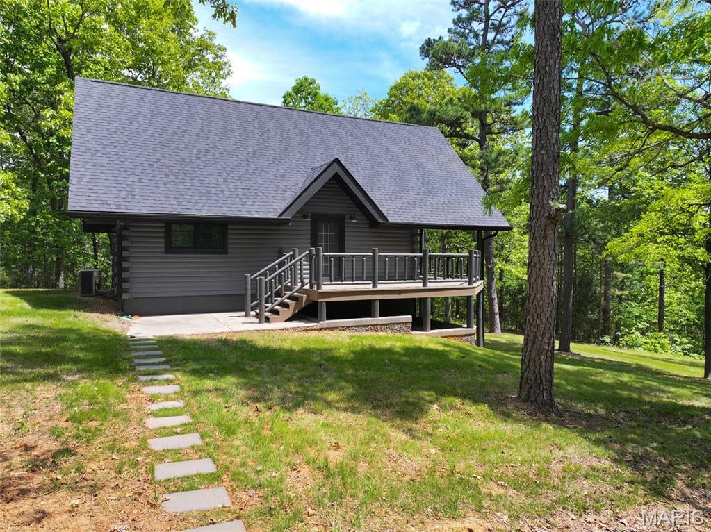 This beautiful 75 +/- acre timber tract sits off Pelican Ridge Road and offers the privacy, seclusion, and hunting opportunity that make this part of Washington County so desirable. Passing through the gated entrance, you'll immediately appreciate the seclusion this property provides. A single trail winds through the timber, offering easy access to the property for hunting, scouting, or simply enjoying the land. The mix of timber and terrain creates excellent habitat for deer and turkey, giving you solid hunting opportunities right out your back door. Tucked away in the timber sits a beautiful 1,560 +/- square-foot log cabin that makes for a perfect weekend retreat or hunting lodge. The cabin features four bedrooms and two full baths, along with a finished kitchen and plenty of space to relax after a long day in the woods. Step out onto the back porch and take in the breathtaking views overlooking the rolling hills of Washington County, a picture-perfect setting to enjoy morning coffee or an evening of success in the woods. Whether you're looking for a hunting getaway, a private retreat, or a place to spend time with family and friends, this property offers a comfortable cabin and quality hunting ground in a beautiful setting. Call today to schedule your own private tour of this Washington County property!