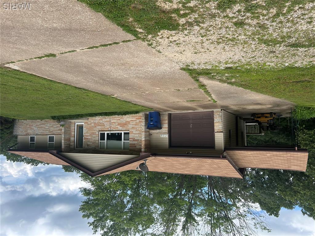 4 bedroom home on 5.7 acres. Ranch style home has a large living room with lots of natural light. Living room has a propane log fireplace . Large kitchen/dining room. All appliances stay. Stove and dishwasher are newer. Sliding doors lead to a deck off the kitchen with a beautiful private yard. Kitchen has a door that leads to the one car garage. Garage has a carport attached.  Main level hall  has a pantry closet, coat closet and niche once used for a land line phone. This has a cabinet space and drawers. The master bedroom is large with an attached bath with double sinks and walk-in shower. The master has a bay window facing the backyard and a wall closet. 2nd and 3rd bedrooms are large and are being used as an office and storage. Lower level has a kitchen, laundry and storage in a large area at the bottom of the stairs. This would make a great project room too! Large enough for exercise equipment! Lower level also has a separate family room with sliding doors to the lower level patio, a third bathroom and the 4th large bedroom. Adjacent to the lower level kitchen is a door leading to a workshop that has it's own outdoor exit. Roof was replaced in 2022, water line for septic and septic cleaned in 2024. Furnace and AC were installed in 2020. New retaining wall that has stopped basement seeping. Not older than a year. Beautiful large yard with a newer metal equipment building just past the house. Large enough for a tractor, lawn mowers and more. Also a shed behind it. 
The address for this property is Highway N but the property actually sets off a gravel side road with an unofficial name of Echo Ridge. There is a street sign.