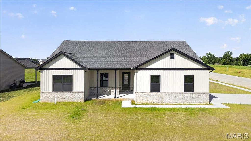 New construction home in the desirable Quail Ridge subdivision, located directly across from Mystic Oak Golf Course. This ranch-style home offers approximately 1,731 sq ft with a split-bedroom floor plan, 3 bedrooms, and 2 full baths. The main living area features an open layout with Coretec LVP flooring and an upgraded electric fireplace with mantel. The kitchen includes quartz countertops, a GE appliance package, and ample cabinetry. The primary suite offers a spacious layout with a large walk-in closet and a private bath featuring a full tile shower and ceramic flooring. Additional features include a full unfinished basement with bathroom rough-in, 9’ ceilings, 92% high-efficiency HVAC system, and all wood shelving throughout. Exterior highlights include an oversized covered patio, stamped concrete, corner lot, and side-entry garage. Located in a well-established HOA community offering amenities including a clubhouse, fishing lakes, swimming pool, and sidewalks.