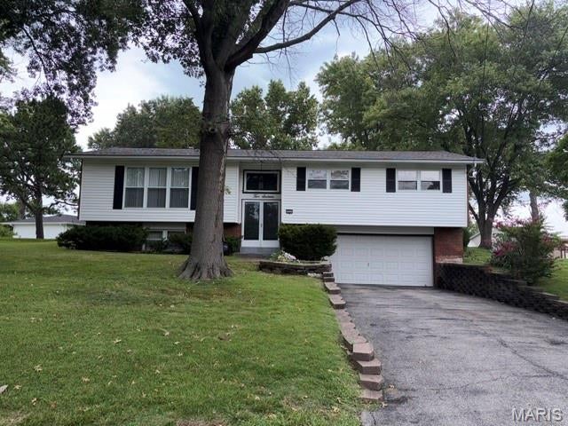 Welcome to 216 Slover Lane! This is a solid brick home that has been well maintained over the years with some recent major modern capital improvements including the roof, siding, and HVAC system .  These big ticket items will providing peace of mind and efficiency for years to come.

Step inside to find a bright, functional floor plan featuring three generously sized bedrooms with ample closet space. The living spaces flow naturally, offering plenty of room to relax and entertain. Downstairs, expand your living area in the versatile finished basement, with full bathroom, and fireplace, perfect for a home theater, rec room, home gym, or work space.

Step outside to enjoy the expansive private, level backyard, ideal for weekend barbecues, gardening, pets, or play. Conveniently located near Interstate55, Target, Home Depot, and Schnucks, ... all within a mile!!!!    This Home checks every box.
