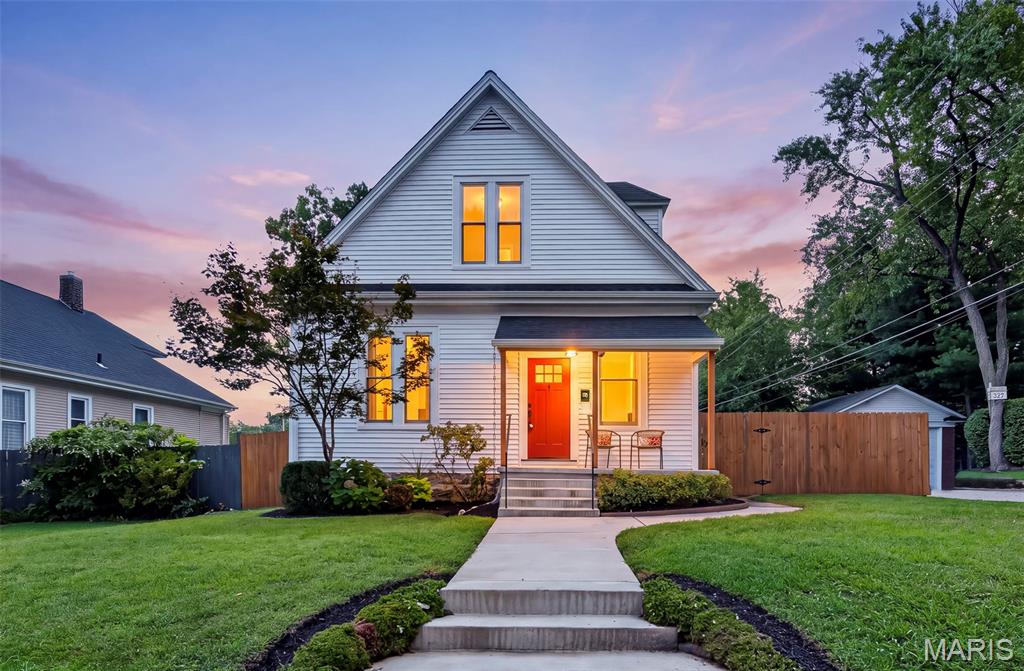 Welcome to desirable Lindenwood Heights! This charming and updated 1.5 story home offers 1,872 square feet of inviting living space, a 1 car detached garage and numerous updates. Hardwood flooring and a professionally painted interior create a warm, welcoming feel. The living room features a ceiling fan with light and opens to the dining room, showcasing hardwood flooring, wainscoting, exposed brick and crown molding. The kitchen boasts custom cabinetry with crown molding, granite countertops, a breakfast bar and an atrium door leading to a newer deck, paver patio and level, fenced backyard. The main floor primary suite offers hardwood flooring, a ceiling fan with light and walk in closet, while the updated bath features wainscoting, an adult height double vanity, ceramic tile flooring, a ball and claw freestanding soaking tub and step in shower with tile surround. Upstairs are two additional bedrooms with hardwood flooring, professionally painted interiors, ceiling fans with lights and updated fixtures, along with a hall bath featuring ceramic tile flooring and a shower and tub combination with tile surround. The lower level provides additional flexible living space with a recreation room ideal for a family room, home office or entertaining. Outside, enjoy a level, fenced backyard, 1 car detached garage and storage shed. Major updates include roof, siding and HVAC in 2025, plus new windows, fence, deck and finished garage interior in 2020. Conveniently located near schools, universities, shopping and parks, this Lindenwood Heights home offers classic character, thoughtful updates and a desirable location.