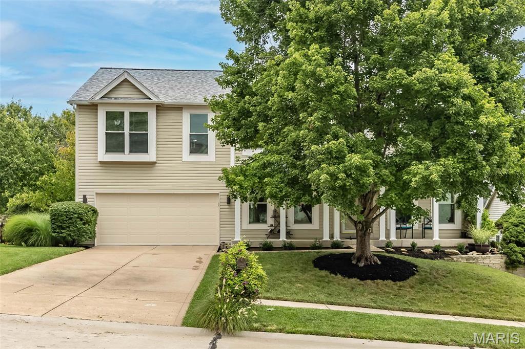 Experience this beautifully updated 4-bedroom, 4-bathroom, two-story home with more than 3,700 sq. ft. of finished living space in the Francis Howell School District. Since it was built, the homeowners have meticulously maintained and upgraded the property, blending elegance, function, and timeless appeal. Upon entry, the formal dining room sits to the left, while a cozy library with custom bookshelves and sliding French pocket doors is to the right—perfect for reading or working from home. The expansive family room features a wood-burning fireplace and abundant windows that fill the space with natural light, offering plenty of seating for everyone on movie night. The kitchen includes granite countertops, newer stainless-steel appliances, updated cabinetry, and hardwood flooring, with seating at the island or in the breakfast nook. Step from the kitchen onto the maintenance-free deck and enjoy views of the beautiful backyard with your morning coffee.
Upstairs, you’ll find a large bonus area and four bedrooms, including an exceptionally spacious primary suite with a walk-in closet and beautiful bath featuring a separate shower, soaking tub, dual sinks, and private water closet. The three additional bedrooms offer generous closets and share an updated full bath. The finished walkout lower level is ideal for entertaining, with a recreation area, bar, game area, full bath, and ample storage. Additional highlights include fresh landscaping, a lush, level backyard, a large maintenance-free deck, a spacious main-floor laundry room with shelving, a covered front porch, a fully finished garage with epoxy flooring, and subdivision amenities including a neighborhood pool, clubhouse, lake, and basketball court. This truly beautiful home is ready for you to make it yours.