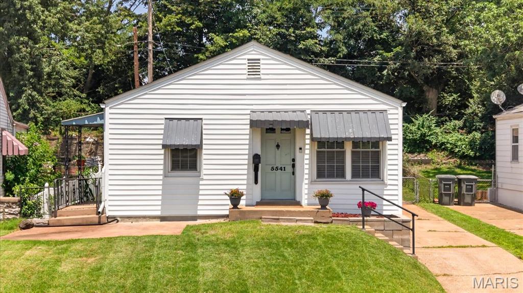Classic South City charm meets thoughtful updates in this beautifully maintained bungalow, where inviting living spaces, a surprisingly spacious kitchen, and a beautifully renovated bath come together to create a place you’ll love calling home. Step inside to a light-filled family room featuring gleaming hardwood floors and plenty of space to relax or gather with family and friends. Just beyond, the adjoining breakfast room provides the perfect spot for everyday dining and flows seamlessly into the updated kitchen. Offering far more space than you’d expect, the kitchen features abundant cabinetry, generous countertop space, stainless steel appliances, and a functional layout designed for everyday living. The primary bedroom offers direct access to the backyard deck, creating a peaceful retreat and an easy connection to the outdoor living space. The second bedroom provides exceptional versatility and includes main-floor laundry hookups, giving you the option for convenient one-level living while still maintaining laundry in the lower level. The fully renovated bathroom is a true showpiece, showcasing a custom tiled walk-in shower with glass enclosure, stylish vanity, updated fixtures, and beautiful designer finishes. The full unfinished lower level offers abundant storage along with endless possibilities for future living space. Outside, you’ll find a fenced backyard with plenty of green space to enjoy, along with a spacious deck that’s ideal for grilling or relaxing. An oversized detached one-car garage provides exceptional storage and everyday convenience. Other improvements include new water heater (2021), furnace (2023), newer roof (2020) and blinds (2026).  Ideally located in the heart of South City, you’ll enjoy easy access to parks, neighborhood favorites, shopping, restaurants, and major highways, offering the perfect blend of classic neighborhood charm and an unbeatable location.