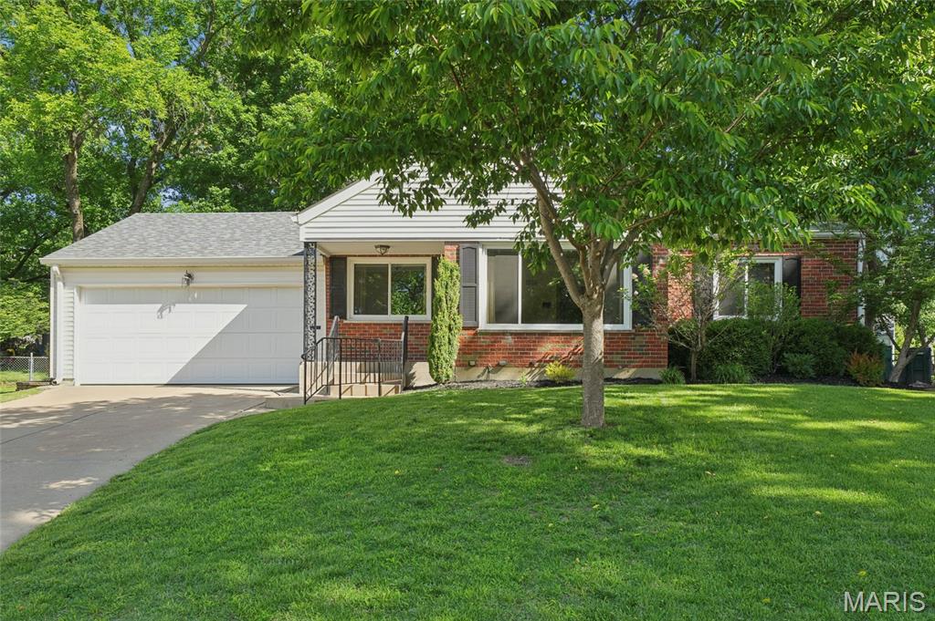 Charming three-bedroom, one-bath home featuring refinished hardwood floors and an open living and dining room combination. A large picture windows in the living room fills the home with abundant natural light. The spacious updated kitchen offers lots of cabinet and counter space, new porcelain flooring, gas oven, reverse osmosis water filtration, and a new garbage disposal. Remodeled bathroom (2024) and new windows throughout (2026) provide modern comfort and energy efficiency. The finished basement with recreation and a bar area creates the perfect space for entertaining or relaxing. Step outside to a beautifully manicured park-like yard with a large backyard, mature shade trees, patio ideal for BBQs and gatherings, storage shed, and a two-car garage for added convenience. The new owners will love the convenience of being close to highways, parks, Community Center, and tons of great restaurants.