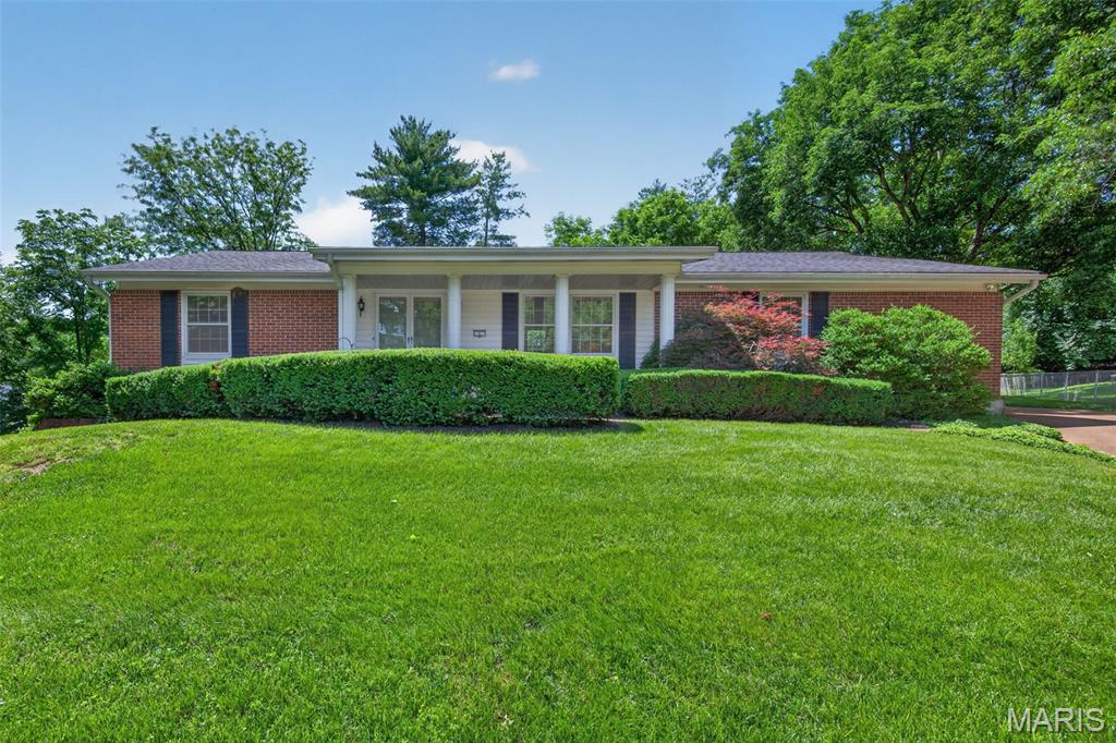 Lovingly maintained and tucked away at the end of a quiet cul-de-sac in the highly sought-after Woodsmill subdivision, this expansive 4-bedroom, 3-bath ranch offers the perfect blend of space, comfort, and convenience. Backing to Henry Elementary School, the home features a flat, private backyard ideal for relaxing or entertaining.
The spacious family room is highlighted by a cozy wood-burning fireplace and sliding glass doors that open to a ground-level deck overlooking the serene backyard. Original hardwood flooring lies beneath the carpet in the living room, family room, and all bedrooms, offering incredible potential. Newer windows throughout the home fill each space with abundant natural light.
The large eat-in kitchen is equipped with oak cabinetry, a built-in double oven, microwave, and a refrigerator that stays with the home. The primary suite offers two closets, including a walk-in closet, along with a private en suite bath featuring a large vanity and walk-in shower.
The finished lower level provides exceptional additional living space with a generous recreation room complete with a bar, making it the perfect setting for entertaining. You'll also find two bonus rooms, two storage areas, and a dedicated laundry room, ensuring there's room for everyone and everything. The oversized garage includes additional space ideal for a workshop, hobby area, or storing lawn and garden equipment.
Enjoy access to neighborhood amenities, including a clubhouse and fishing pond, all while being just steps from Henry Elementary, close to shopping, dining, entertainment, and major highways. Located within the highly acclaimed Parkway School District, this home truly offers an exceptional lifestyle in one of West County's most desirable communities.