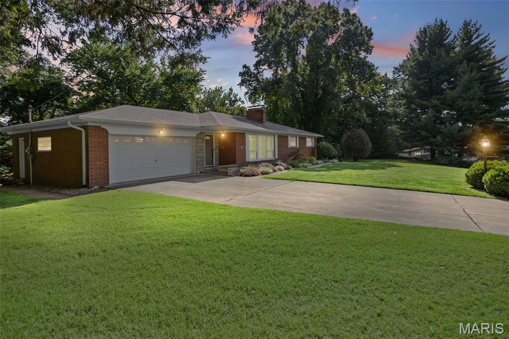 Welcome to this beautifully maintained all-brick ranch home that had been lovingly cared for by its original owner. Situated on over an acre of picturesque, tree-lined property, this three-bedroom, two-full-bath home offers privacy, space, and timeless charm, along with the convenience of Troy, Illinois water. The main level features a spacious layout, large eat in kitchen with double-oven and a two-car garage, while the walk-out basement provides an exceptional amount of additional living space, including a separate kitchen area, large living room, billiards/game room, workshop, and ample storage. With its flexible layout, the lower level could easily serve as a mother-in-law suite or additional entertaining and living area. A unique built-in charcoal grill in the basement living room provides a cozy option for chilly evenings or even a backup cooking option during a power outage. Step outside from the walk-out basement and enjoy the gorgeous, park-like backyard surrounded by mature trees—an incredible setting to relax, entertain, and enjoy the privacy this special property has to offer. Ages: 2023- 40 gal. water heater, 2019- Roof. Schedule your private tour with your Realtor today!