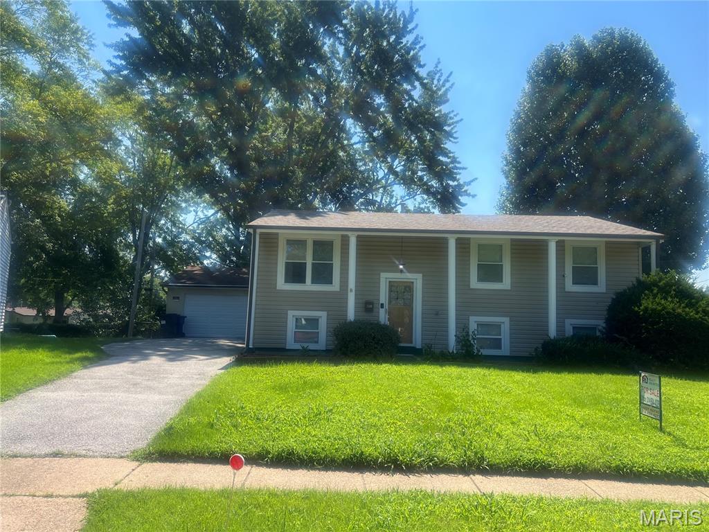 Welcome home! An ideal home for those seeking comfort in a quiet neighborhood.  This split level home has hardwood floors throughout, ceramic tiles in the updated bathrooms and kitchen with plenty of cabinets.  Breakfast/dining room walkout to a large wooden deck to enjoy for those summer barbecues, plenty of space for outdoor entertaining, 2 car detached oversize garage with a front door and side steel door to backyard.  Lower level walkout to the fenced back yard offers a large family room and a 3rd bedroom that owner used as an office.   Recent updates new upper bathroom tiles and safety rails, new entry steel door on garage 2026, new slide door to deck, new roof with a transferrable warranty, siding and gutters 2022.  MOVE IN READY! Don't miss out on this one!  Home is being sold As-Is.