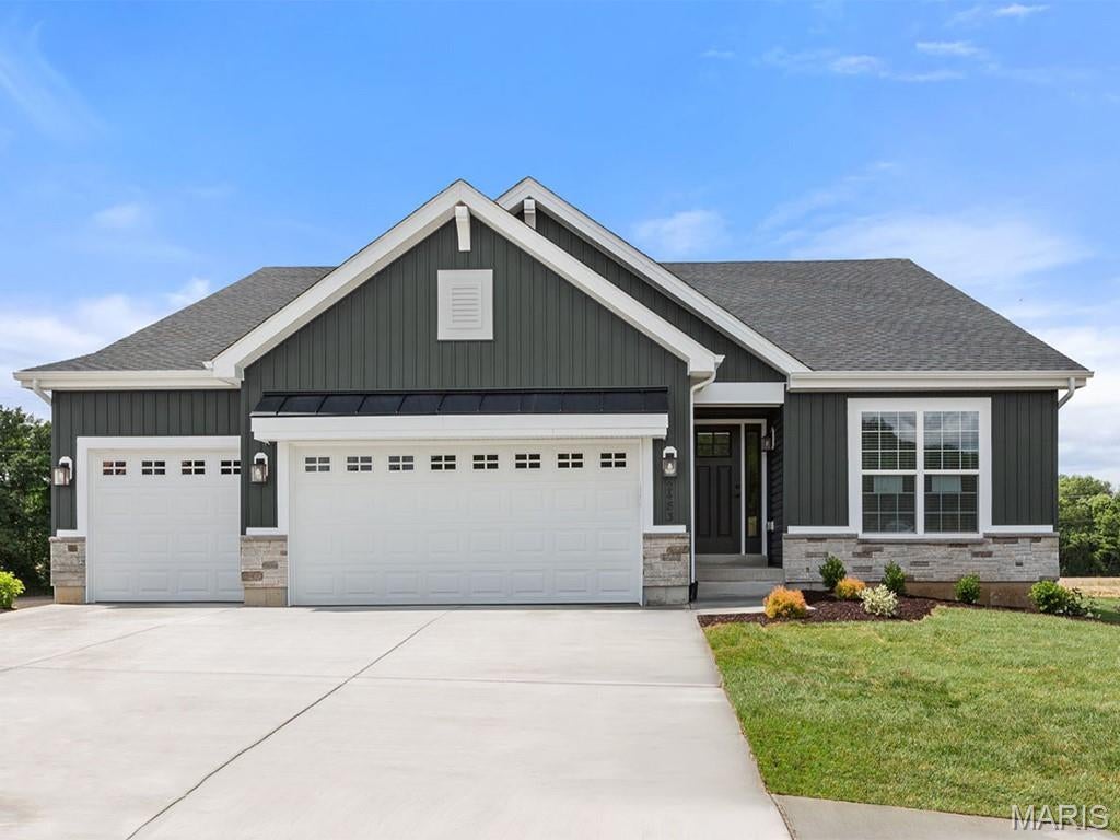 New McBride Homes Maple Expanded ranch 3BR, 2BA, ready this winter! Walkout homesite & Rustic Farmhouse exterior! This home has a 3-CAR GARAGE, open floor plan w/vaulted ceilings, living rm w/ceiling fan, 6’ windows, & wood laminate flooring in the main living area. The kitchen has Landen Burlap 42” cabinets, lg center sq. island w/breakfast bar, quartz countertops, & stainless GE appliances. The master suite has a ceiling fan, walkin closet, & private bathroom w/a corner tub w/window, shower w/seat, dual vanities, & private toilet rm. 2 more bedrooms, 2nd full bath, & main floor laundry add convenience. Upgrades include 2 panel interior doors, garage coachlights, LL ¾ bath rough-in & more. The onsite amenities at Wilmer Crossing include a community playground, pavilion with BBQ pits and picnic tables, and pickleball court. Enjoy peace of mind with McBride Homes’ 10 year builders warranty and incredible customer service! Similar photos shown.