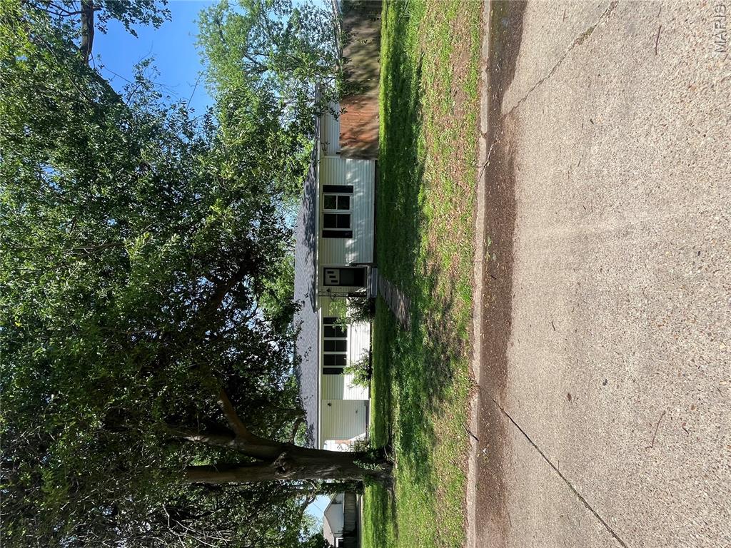 Rare find! A great family home at an affordable price. This three-bedroom, one bath beauty has been updated throughout. The large living room and adjoining dining room feature original hardwood flooring which has been refinished. The kitchen has all new cabinets and counter tops, flooring and a new dishwasher. There are three bedrooms, each with plenty of closet space, hardwood flooring and ceiling fans and for an extra bonus there is a great walk-in closet in the hallway. The new Heat and Air unit is sure to keep the temperature comfortable in the winter and summer, and since it is getting storm season in our area, it is good to know that you can open a door in one bedroom and go downstairs to an underground storm cellar.