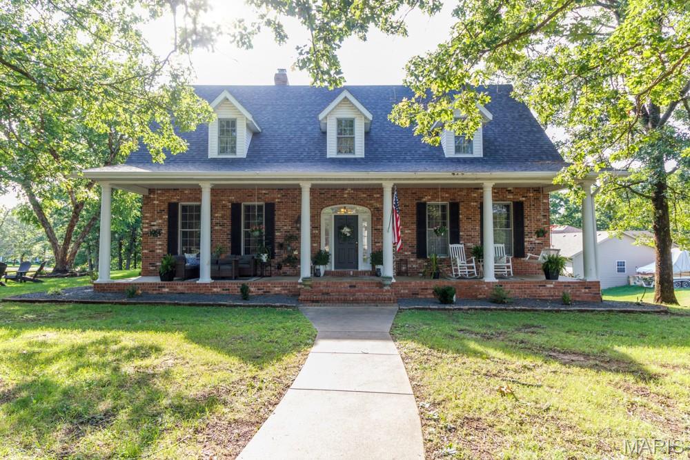 DON'T HESITATE TO SET UP YOUR APPOINTMENT  TO TOUR THIS TIMELESS BEAUTIFUL  SOUTHERN STYLE HOME
  THIS ALL BRICK HOME OFFERS A LOT OF SPACE GREAT FOR ENTERTAINING,  OR A LARGE FAMILY.  THIS UPGRADED KITCHEN with QUARTZ COUNTER TOPS and  STAINLESS APPLIANCES. Updated  backsplash,  LARGE  WINDOWS  throughout for A LOT  of NATURAL LIGHTING will Make  this already spacious home feel even larger. THE LIVING ROOM with VAULTED CEILINGS and A FIREPLACE . The MAIN LEVEL MASTER SUITE offers  A CUSTOM TILE SHOWER & TILE FLOORING.  THIS home offers  5 SPACIOUS BEDROOMS, and 4 have their own bathrooms, A bonus room above the garage with Its own private access.  This home has a  LARGE  SEPARATE FORMAL DINING ROOM as well as the Eat in KITCHEN.   A very handy LARGE LAUNDRY AREA with MANY CABINETS.  The lower level has direct access with an asphalt driveway to the lower level garage with great a storage area. Additional bedrooms and a full bath was completed recently.  Keep your coffee cup full as you will LOVE THE LARGE COVERED FRONT PORCH.   THIS HOME IS IN  A GREAT AREA ON BLACKTOP ROAD. OFFERING OVER 5400 SQ FT OF LIVING SPACE YOU CANT BUILD A NEW HOME FOR THE COST OF THIS TIMELESS BEAUTY.