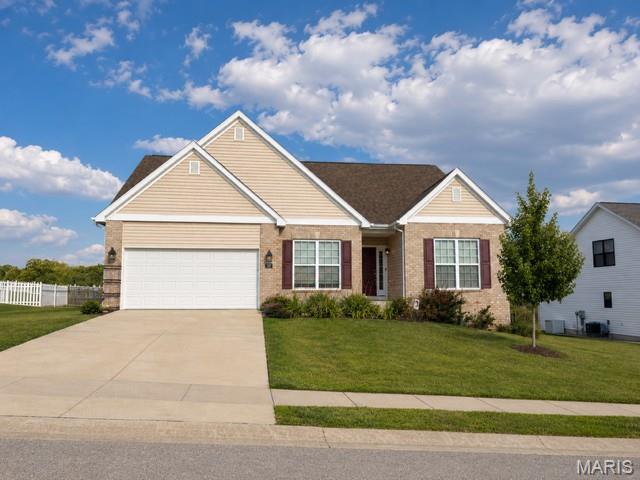 Built in 2022, this well maintained, move-in-ready single-story ranch home is situated on a charming street just outside of town in Edwardsville School District. The thoughtful split-bedroom floor plan maximizes privacy and functional living, featuring a private primary suite with an en-suite bathroom tucked away on one side of the home, while two additional bright bedrooms and a second full bathroom occupy the opposite wing. Luxury vinyl plank flooring flows seamlessly throughout most of the home. In the heart of the home, a gourmet kitchen comes fully equipped with sleek stainless-steel appliances and Quartz countertops opening up to living spaces illuminated by large windows that flood the interior with abundant natural light. The property features an attached two-car garage that opens directly into a highly functional drop zone, providing the perfect dedicated space to organize coats, bags, and shoes as you enter. Outside, a fully fenced backyard offers a private retreat perfect for outdoor activities and relaxation. The basement is a clean slate plumbed for a bathroom.  This exceptional home delivers a peaceful neighborhood setting while maintaining easy, convenient access to nearby towns and great interstate access.
