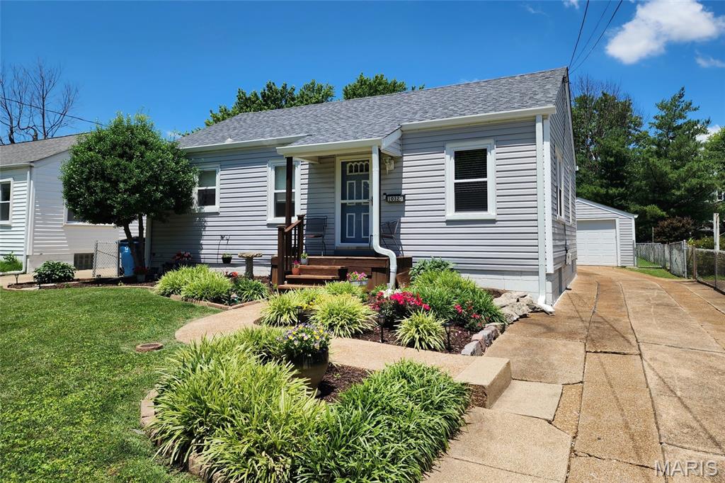 Welcome home, you found it! A handsome/adorable well-maintained  two bedroom, one bath  home with a one car detached garage with a super fun large fenced backyard. The professional landscaping catches your attention from the moment you arrive. A comfortable covered sitting porch creates a welcoming entrance to the home. The floor plan is a delight….step into the living space with a lot of natural light creating a cheerfulness. The living room with a hallway coat closet opens to the eat-in kitchen which boasts lots of counter space, wood cabinetry with all appliances to stay with sale if buyer needs. Appliances include a gas stove, refrigerator, dishwasher and built-in microwave. Two main floor bedrooms are carpeted with good size closets and overhead lighting.  Hallway bathroom with linen closet. The side door from the kitchen leads to the exterior backyard. The lower level includes a laundry room (w/d to stay if buyer wants to include), storage closet and systems;hot water heater(2025), HVAC system, electrical panel (2021). The home sits on a spacious level lot with simple lush flower beds, concrete driveway, fenced backyard, shed and an entertaining patio. New roof (2025), New gutters (2026), New vinyl tilt-in windows(2022), water heater(2025)  storm doors and window treatments. Occupancy inspection in motion. Owner saying goodbye after 20 plus years to move closer to family. This is a fabulous home waiting for your arrival. Note#1: Refrigerator, washer, dryer could stay or be removed. Acknowledge which is best in the offer Note#2 Buyer can pay $50.00 to Window World to transfer the window warranty at closing.