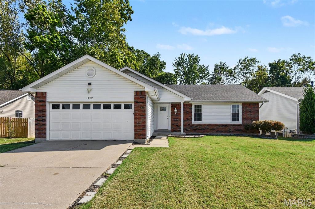 Welcome to 202 Barrington Drive, a charming single-story home nestled on a lot with no rear neighbors in Saint Peters! Featuring a wonderful open floor plan, this 3-bedroom, 2-bathroom home is awash with natural light from skylights above and features high vaulted ceilings, modern LVP flooring, and a cozy brick fireplace. The kitchen boasts stainless steel appliances, while French doors lead seamlessly out to a private patio and spacious backyard perfect for outdoor living from the living room. Additionally, the home hosts a large unfinished basement that is ideal for storage or future expansion. Brimming with potential and ready for your personal touch, this home provides effortless access to everything you need. Schedule your tour today!