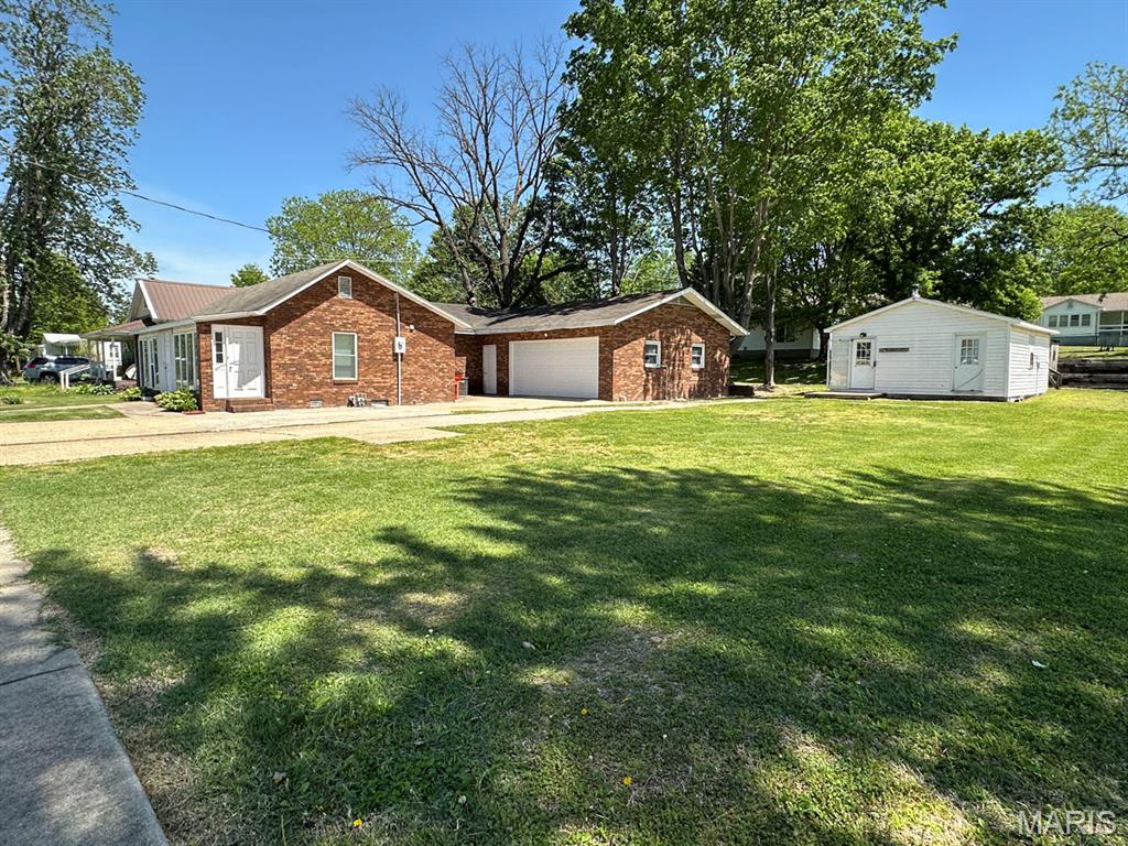 This well-maintained 3-bedroom, 2-full-bath home offers over 1,700 sq ft of comfortable living space with recent improvements and plenty of value! Enjoy central heat and air, low utility costs, and sellers who rave about the affordable heating and cooling expenses. The spacious living room features a vaulted ceiling and a dedicated area for a wood stove (current stove does not stay). Recent updates include new carpeting, vinyl flooring, updates to the hall bathroom, and completed floor joist repairs. The home offers an attached 22x20 garage plus abundant closet storage throughout. Outside, enjoy a large patio perfect for relaxing or entertaining, along with an additional lot featuring a 24x20 detached garage with electric — perfect for storage, hobbies, or a workshop. 
Stay connected with high-speed SEMO Fiber Internet. **Buyers who previously viewed this home are encouraged to take another look and see the improvements that have been made.**

A great combination of space, updates, and affordability — don’t miss this opportunity!