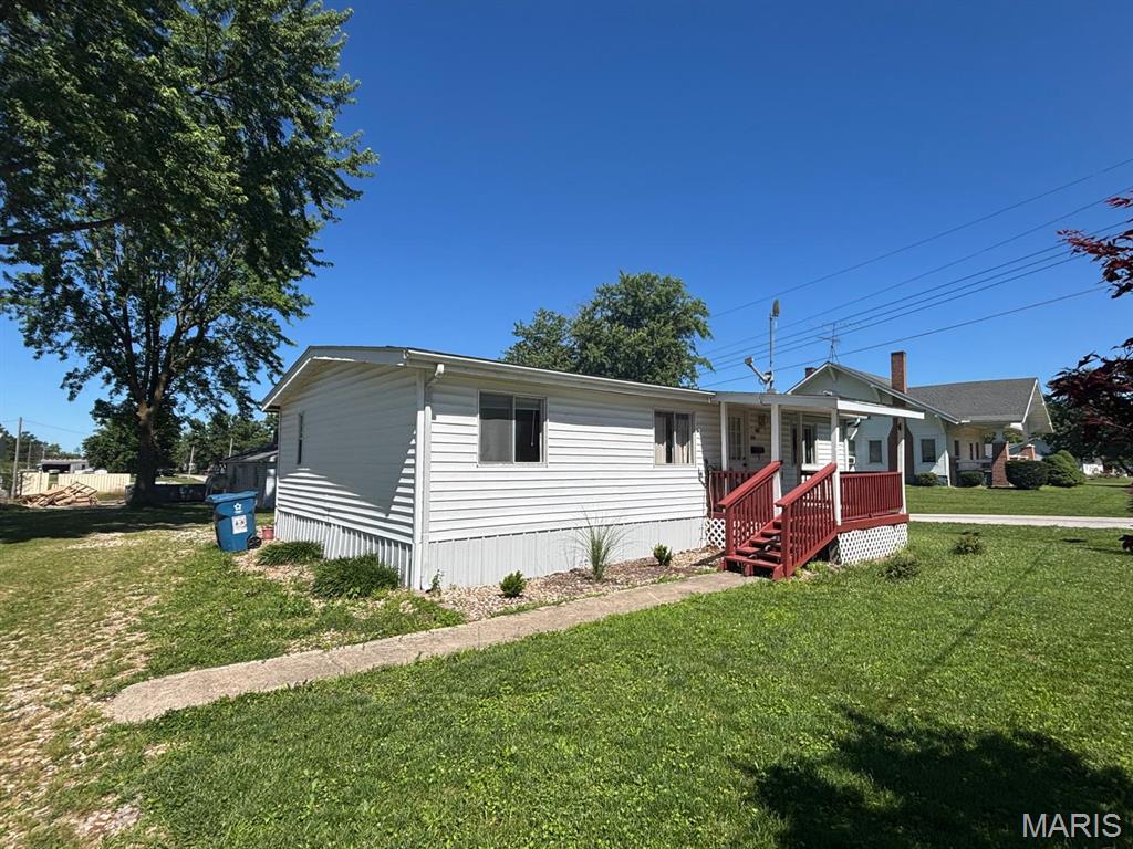 206 N. Washington Street | Shelbyville, MO

Welcome home to small-town living in Raider Country! Located in the desirable North Shelby School District, t 3-bedroom, 1-bath manufactured home offers 960 square feet of comfortable, low-maintenance living space.

Inside, you’ll find new vinyl plank flooring in the kitchen, dining area, and hallway. The home also includes a gas stove, refrigerator, washer, and dryer—making it ready for its next owner.

Relax on the covered front porch, enjoy the back patio, and appreciate the convenient accessible entry. This great corner lot provides wonderful outdoor space along with off-street parking.

Nestled in the quiet rural community of Shelbyville, Missouri with convenient access to local amenities, this property is an excellent choice for a first-time buyer, someone looking to simplify, or an investor seeking a promising addition to their portfolio.

See it. Love it. Make it yours today!