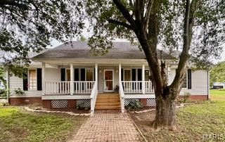 Nestled on two spacious lots at the end of a quiet cul-de-sac, this beautifully updated 2-bedroom, 2.5-bath home is ready for its new owner. Every detail has been refreshed, including new paint, updated flooring, freshly painted cabinetry, deck repairs, and more, so you can move in and start enjoying your new home immediately.  Inside, you'll find oversized bedrooms, each with two large, walk in closets, that offer exceptional space and comfort, along with a stunning cathedral ceiling in the living room that creates an open, airy feel. The large kitchen features abundant cabinet space and a cozy eat-in breakfast area, making it perfect for everyday living and entertaining.  Outside, the property continues to impress with an incredible outbuilding/workshop featuring a bathroom, a two-car garage door, and plenty of additional space for hobbies, storage, projects, or business needs. With its extensive updates, generous lot size, desirable cul-de-sac location, and versatile outbuilding, this property truly offers something for everyone.
