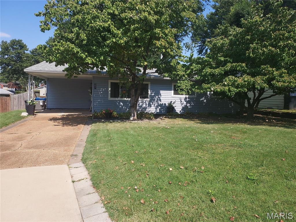 This is such a Cute home 1 step entry, Exterior landscaped yard, 1 Car carport keeps you under cover for unloading groceries. This home is perfect for starting out or scaling down, Fresh paint, updated vinyl insulated windows, roof only 2 years old, hvac and water heater approx 4 years old or less, Kitchen updated with custom Cherry wood cabinets, center island is moveable. Appliances to stay.  Some updated lighting.  Living room has space for any size furniture.  Bedrooms are good size too, Main floor laundry room and a Bonus/storage room could be office or craft room.  Exterior yard is fenced with patio areas. Metal Storage shed for your gardening storage needs. Close to everything, shopping, schools, and highway access.