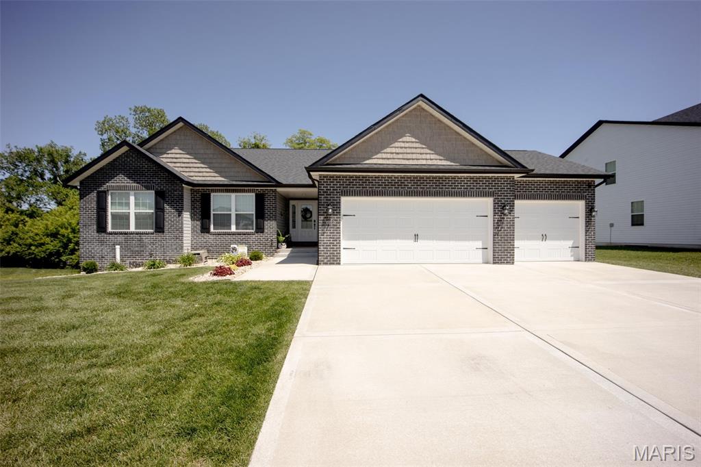 Welcome home to this beautiful 4-bedroom, 3-bath ranch built in  2024 offering the perfect combination of newness without the wait of new construction and with added upgrades standard builders do not include! 
Featuring a spacious 3-car garage with electric car outlet and a thoughtfully designed floor plan, this home is ideal for everyday living and entertaining. 
The main level boasts a modern kitchen complete with all appliances included, ample solid wood cabinetry with soft close doors and drawers, updated backsplash, refrigerator and plenty of workspace. Enjoy meals in the separate dining room or breakfast/coffee nook, or just gather in the inviting living area highlighted by a corner electric fireplace. Step outside to a covered deck overlooking a private, fenced backyard that backs to mature trees, creating a peaceful setting for relaxation. A large patio provides even more space for outdoor entertaining.
The walkout basement expands your living space with a large bonus room, fourth bedroom, and full bathroom
—perfect for guests, a home office, or multi-generational living. Additional storage space offers endless
possibilities.
As an added bonus, the washer, dryer, and extra refrigerator are all included, making this home truly move-
in ready.
Conveniently located near shopping, dining, parks, and Scott Air Force Base, with easy access to major
highways and just minutes from downtown St. Louis, this home offers the best of suburban living with city
convenience.  Showings to start on June 30, 2026.