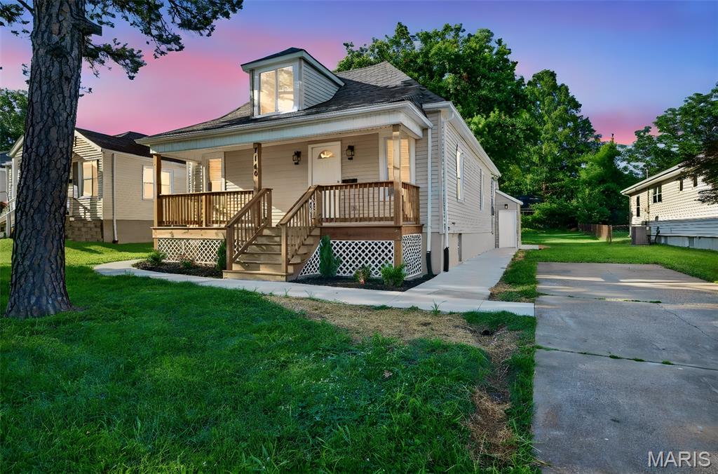 Completely renovated 2-bedroom, 1.5-bath home in desirable Lindenwood Park. Renovation completed with required City of St. Louis permits. Updates include new roof, gutters, siding, windows, exterior doors, covered front porch, sidewalks, electrical panel and wiring, plumbing, and high-efficiency water heater. Open-concept main floor features spacious living area with laminate flooring and an updated kitchen with 42-inch cabinetry, center island, granite countertops, and stainless steel appliances. Both bathrooms have been fully renovated. Convenient main-floor laundry. Large level fenced backyard with gazebo and driveway. Located on a quiet street with easy access to parks, restaurants, shopping, and major highways. Move-in ready and waiting for its new owner.