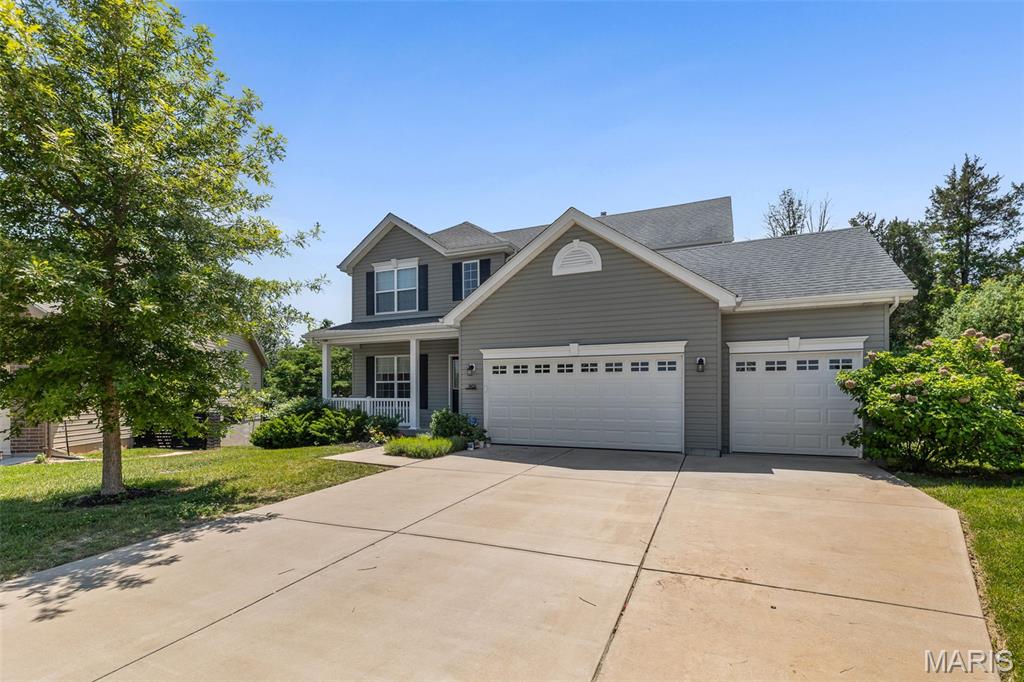 This two story home sits on a quiet cul-de-sac in Winding Bluffs—and from the moment you walk in, it feels brand new. The main level makes an immediate impression with luxury vinyl plank flooring, chic lighting on smart switches, and a wide-open layout that seamlessly connects the kitchen, dining, and family room for modern living. The kitchen serves as the heart of the home, anchored by a large island, crisp white craftsman cabinetry, slate appliances, and a gas oven designed for real cooking. In the family room, a marble gas fireplace and a sunny bay window pull beautiful natural light deep into the space. Upstairs, the primary suite is a true retreat featuring a jetted tub, separate shower, and custom closet organizers that maximize every inch. Three additional bedrooms offer the exact space and flexibility a growing household needs. The full, unfinished lower level represents a massive opportunity to build equity, boasting a 9-foot pour and a bath rough-in already in place for your future expansion. Outside, a low-maintenance composite deck—thoughtfully engineered for a future covered porch—overlooks a pristine, vinyl-fenced yard backed by evergreen trees for year-round privacy. Complete with a spacious three-car garage, this home is situated in the sought-after Fox C-6 district with Guffey Elementary located right inside the neighborhood.